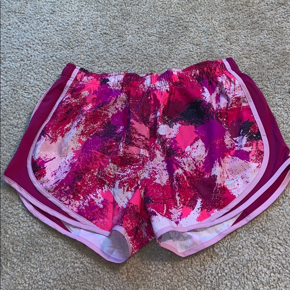Pink splattered Nike running shorts